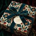 Luxury vintage floral Christmas wrapping paper with teal velvet ribbon by Wrapped Studios.
