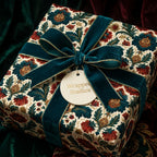Luxury vintage floral Christmas wrapping paper with teal velvet ribbon by Wrapped Studios.