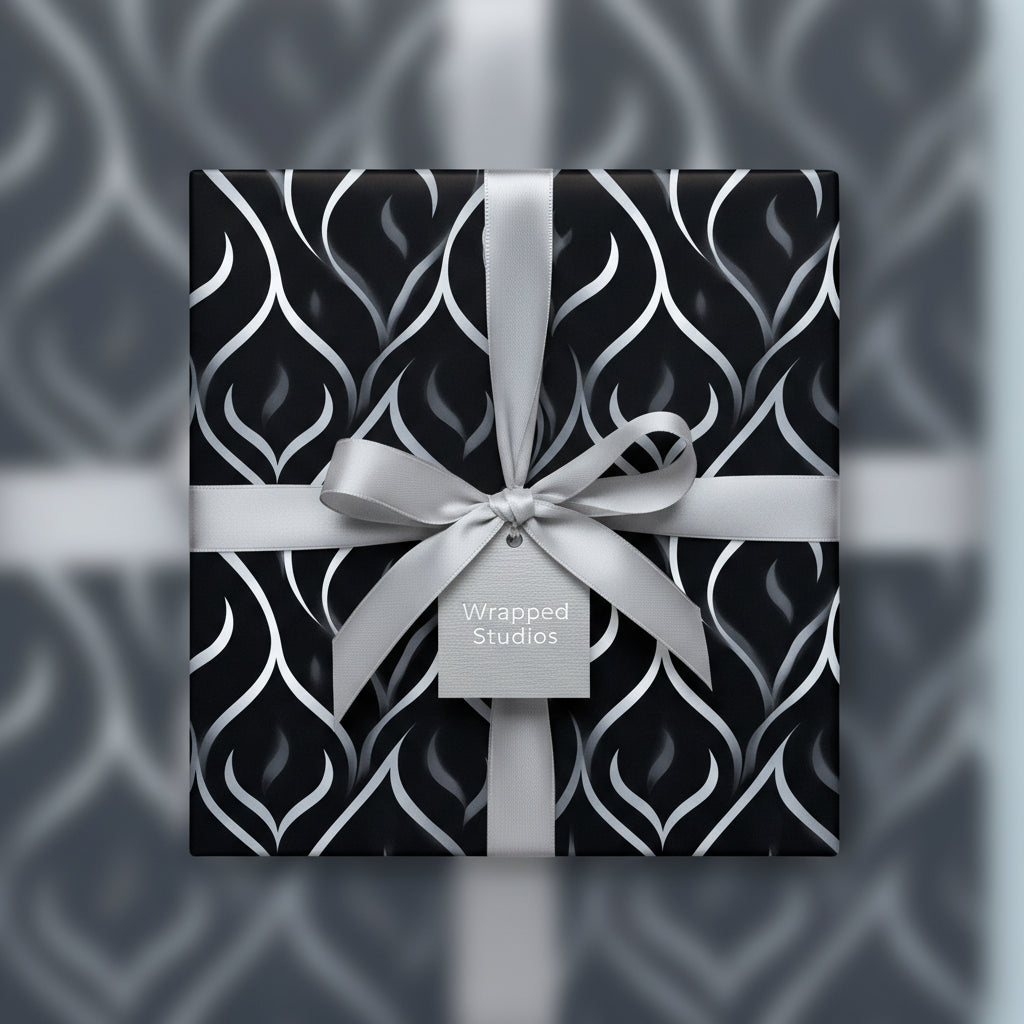 Elegant black and silver luxury gift wrap with ribbon and bow for sophisticated presents.