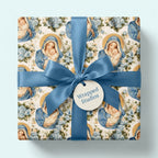 Vintage Madonna and Child religious Christmas wrapping paper with a blue satin ribbon by Wrapped Studios.