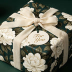 Luxury dark green floral gift wrap with cream velvet ribbon and a 'For You' tag, by Wrapped Studios.