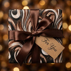 Elegant brown marbled wrapping paper with a satin bow and For You tag by Wrapped Studios.
