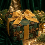 Luxury Christmas gift wrap with botanical pinecone print and gold velvet ribbon by Wrapped Studios.