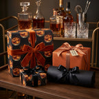 Whiskey-themed wrapping paper with velvet ribbons for elegant gifts on a bar cart.