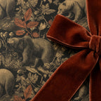 Vintage woodland bear wrapping paper with a luxury rust velvet bow by Wrapped Studios.