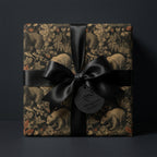 Vintage woodland bear wrapping paper on a luxury gift box with a black satin bow by Wrapped Studios.