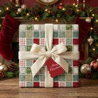Vintage Christmas wrapping paper with a red and green patchwork pattern and cream bow, by Wrapped Studios.