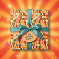 Square gift wrapped in colorful retro circle pattern paper with teal ribbon, saying "A little something bright!".
