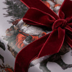 Vintage Santa Christmas wrapping paper with a luxury red velvet bow by Wrapped Studios.