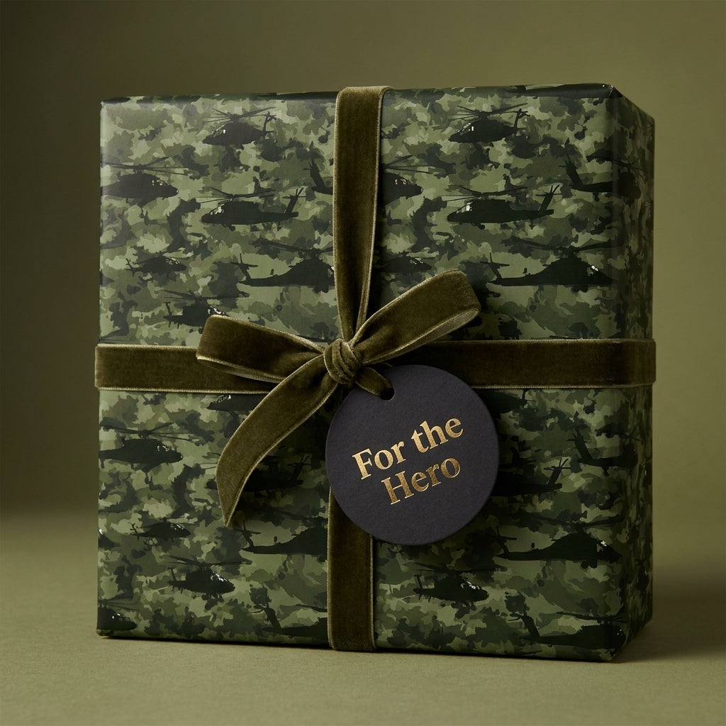 Military camo wrapping paper with helicopter pattern and olive velvet ribbon by Wrapped Studios.