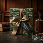 Camouflage military wrapping paper with helicopters, bronze bow, and soldier gift tag by Wrapped Studios.