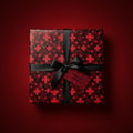 Elegant gift box with red cross pattern wrapping paper, black ribbon, and "A Special Delivery" tag.