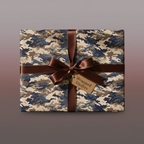 Modern gift wrapped in camouflage print paper with a brown satin ribbon and tag.