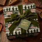 Military wrapping paper with soldier silhouettes and a green velvet bow on a birthday gift by Wrapped Studios.