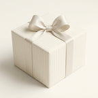 Luxury cream striped wedding wrapping paper with a satin bow by Wrapped Studios.