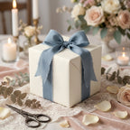 Elegant cream pinstripe wedding gift wrap with a dusty blue chiffon bow by Wrapped Studios.