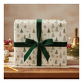 Elegant Christmas gift in minimalist evergreen tree wrapping paper with a plush green velvet ribbon, festive holiday decor.