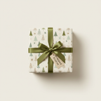 Christmas tree pattern wrapping paper with an olive green ribbon, bow, and gift tag, perfect for luxury holiday gift wrap.