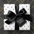 Minimalist black and white cross wrapping paper with a satin bow by Wrapped Studios.