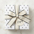 Religious cross wrapping paper with a cream bow on a gift box, perfect for baptism, by Wrapped Studios.