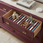 Red, blue, and cream striped wrapping paper used as a decorative drawer liner, by Wrapped Studios.