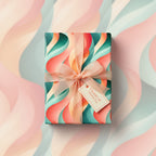 Stylish gift with teal, coral and peach wave wrapping paper and sheer ribbon.