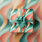 Teal ribbon on retro wavy pattern gift wrap with "With Love" tag for birthdays or celebrations.