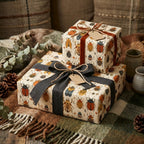 Wrapped gifts use beetle print wrapping paper with brown and grey ribbon and twine bows.