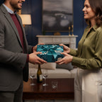 Woman exchanging a gift wrapped in teal floral wrapping paper and matching ribbon.