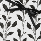 Monochrome floral wrapping paper with black ribbon, an elegant gift wrap from Wrapped Studios.