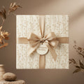 Elegant gift box wrapped in floral wrapping paper with gold ribbon and bow, perfect for birthday or wedding presents.