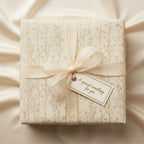Elegant gift wrapped in cream floral wrapping paper with sheer ribbon and a "special something for you" tag.