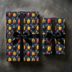 Gifts wrapped in beetle-patterned wrapping paper with a black satin ribbon.