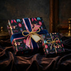 Luxury gift wrap with a beetle print, velvet ribbon, and gold string on dark paper.