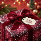Burgundy Christmas gift wrap with star pattern, velvet ribbon, and "Warm Wishes" tag.