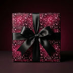 Burgundy Christmas gift wrap with elegant black satin bow.