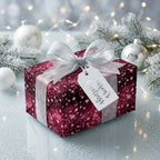 Burgundy Christmas gift wrap with stars, silver ribbon, and "Season's Greetings" tag.