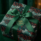 Elegant floral wrapping paper with green ribbon and "With Love" tag, by Wrapped Studios.
