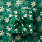 Elegant floral wrapping paper, emerald green ribbon on square gift box, Christmas or birthday present.