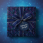 Navy geometric gift wrap with ribbon and "Wishing You Starlight" tag, perfect for Christmas or a special occasion.