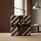 Luxury gift wrap with brown ribbon & geometric pattern, perfect for elegant birthday or anniversary presents.