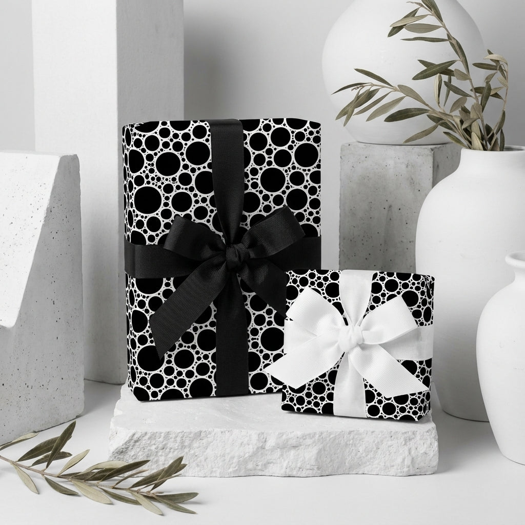 Modern black and white wrapping paper with circle pattern on luxury gifts by Wrapped Studios.