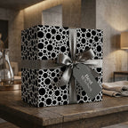 Modern black and white bubble wrapping paper with a silver ribbon and Best Wishes tag by Wrapped Studios.