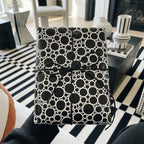 Modern black and white wrapping paper with a bubble pattern and twine bow by Wrapped Studios.