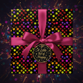 Black gift box in festive confetti wrapping paper with a pink ribbon, perfect for birthday celebrations.