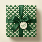 Shamrock wrapping paper with green satin bow by Wrapped Studios, ideal for St. Patrick’s Day.