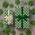 St. Patrick's Day shamrock wrapping paper on gift boxes with velvet ribbon by Wrapped Studios.