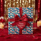 Valentine's Day gift wrapped in heart print wrapping paper, with a red satin bow and "Happy Valentine's Day" tag.