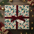 Elegant floral wrapping paper with deep red velvet ribbon, perfect for Christmas or holiday gifts.