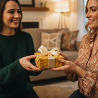 Two women exchanging a gift wrapped in yellow floral wrapping paper with a cream ribbon.